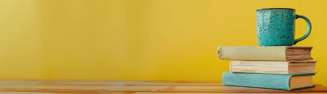 stack of books on yellow background